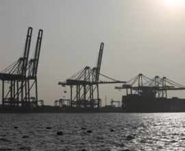 A container ship is pictured docked at the Colombo South Harbor funded by China in Sri Lanka January 21, 2016. Sri Lanka's inflation measured in a new National Consumer Price Index (NCPI) was up 4.2 percent in December from a year earlier, compared with a 4.8 percent rise in November, the Department of Census and Statistics said on Thursday. REUTERS/Dinuka Liyanawatte - RTX23EF9